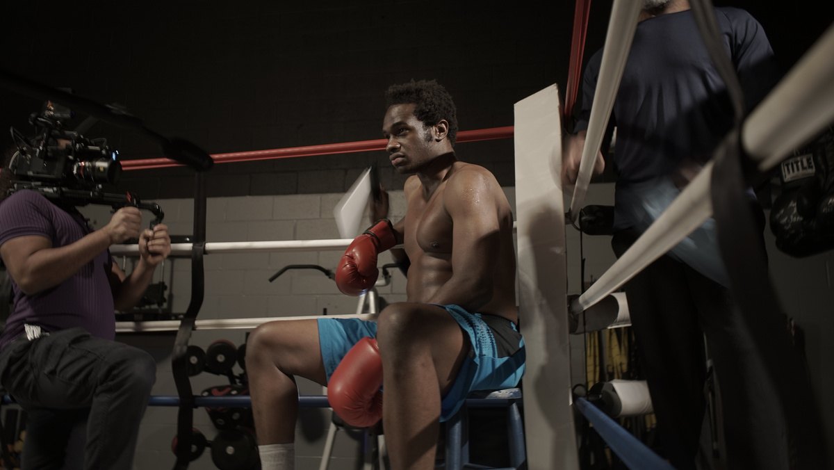 Boxer resting in the corner of a ring during a shoot